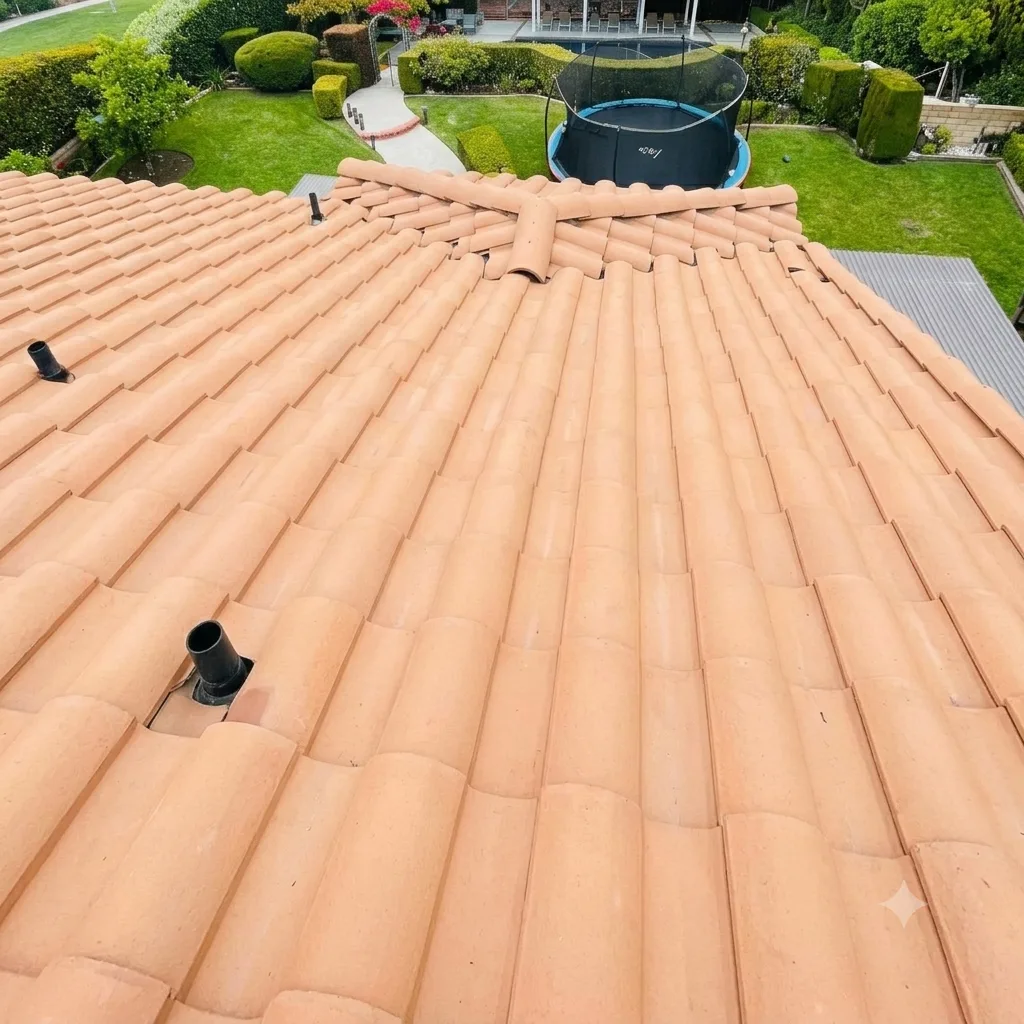 Concrete tile roof after GreenCal cleaning, restored to its natural terracotta color